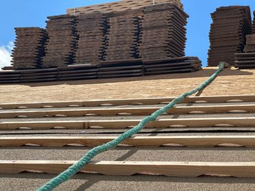 Eagle arched batten on a tile roof with premium underlayment.
