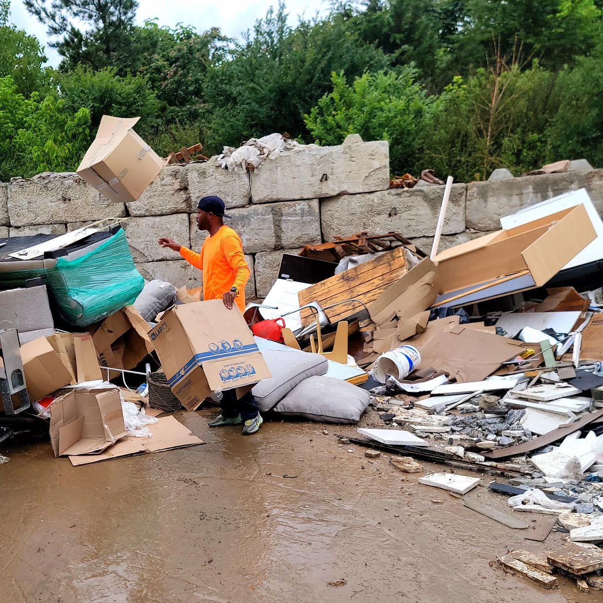 Tay, owner of Grab And Go Junk Removal in Atlanta, GA, disposing junk at a local transfer station.