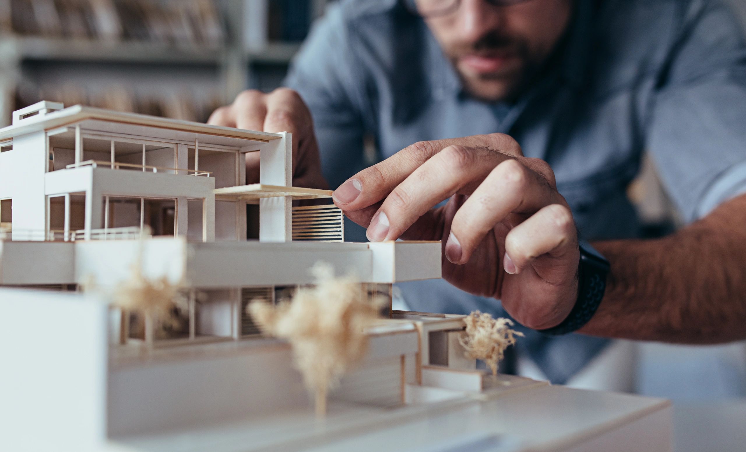 An architect making a model of a house