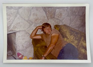 A man is lying on a couch.