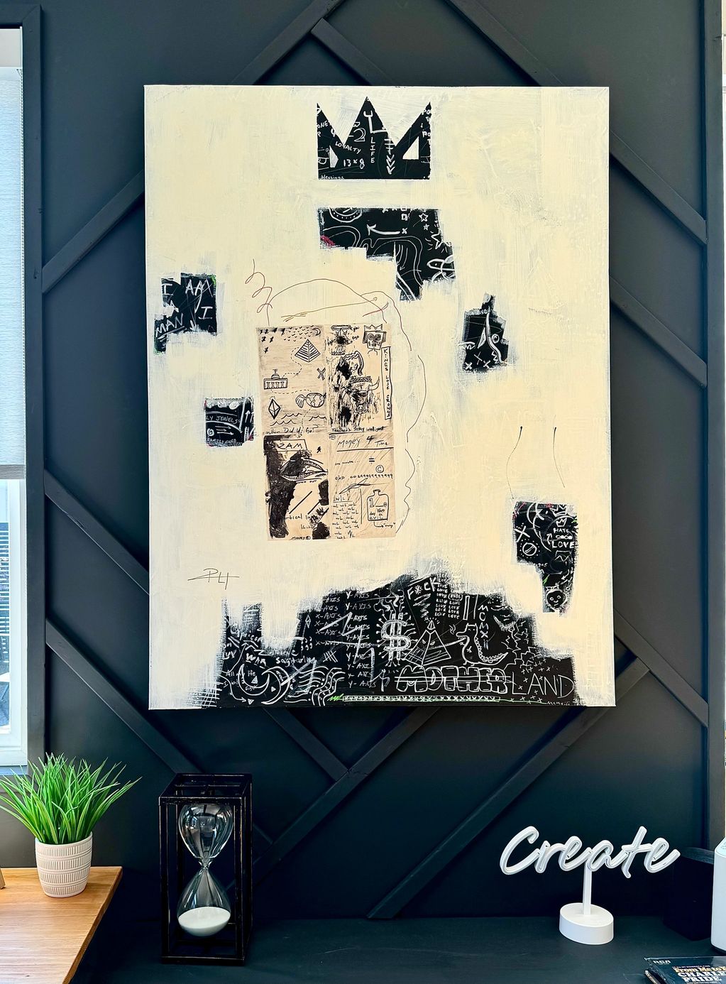 Abstract mixed media artwork with black and white elements on a beige canvas.