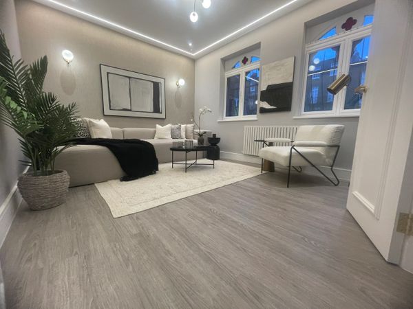 Modern living room with neutral tones and minimalist decor.