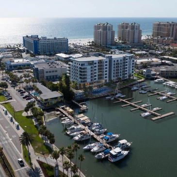 Marina with boats and nearby modern buildings.