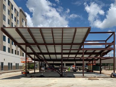 Steel building with a canopy construction