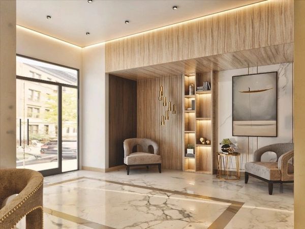 Modern lobby area with marble floors and cozy seating.