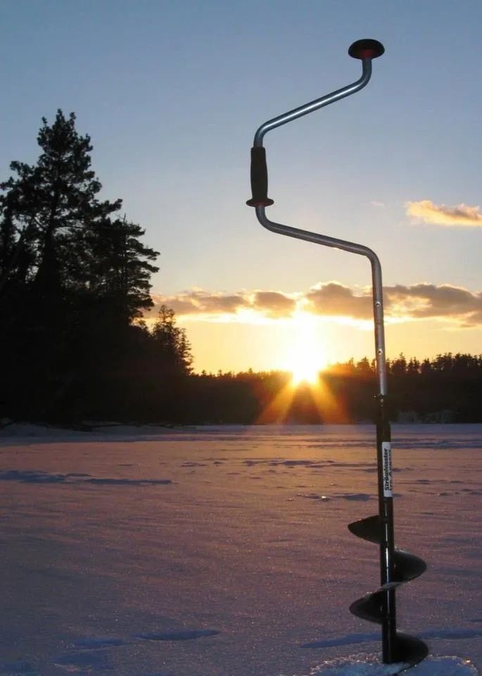 ice fishing with hand auger