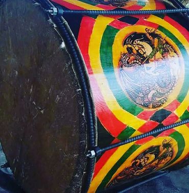 A colorful traditional drum with intricate designs and vibrant patterns.