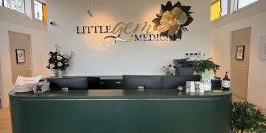 Reception desk at Little Gems Medical with elegant decor and welcoming atmosphere.