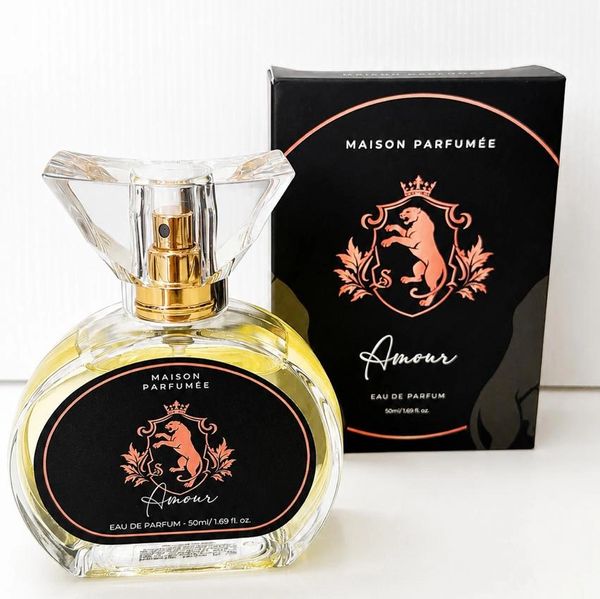 Elegant Maison Parfumée Amour perfume bottle and box in black and gold.