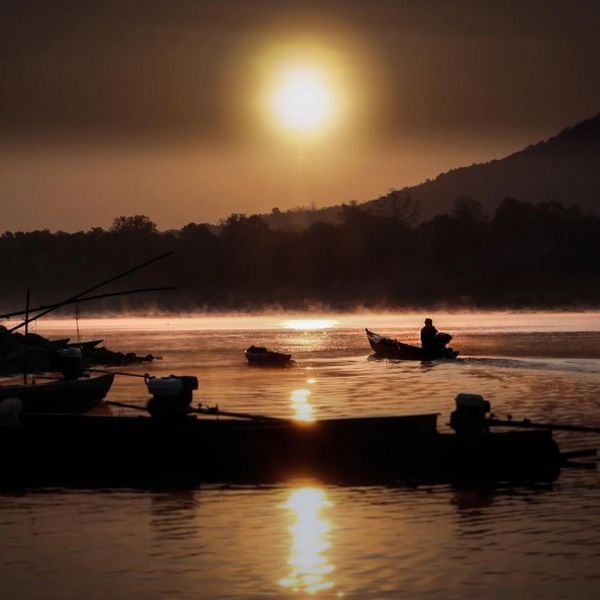 Sunrise solo fishing journey up the Mekong River at Amphoe Khong Chiam