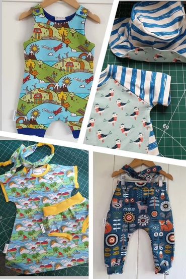 Four colorful handmade baby outfits with playful patterns and accessories.