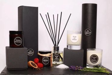 A set of luxury scented candles and reed diffuser with natural ingredients.