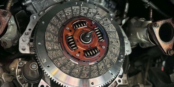 Close-up of a car clutch assembly within an engine.
