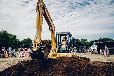 child driving excavator