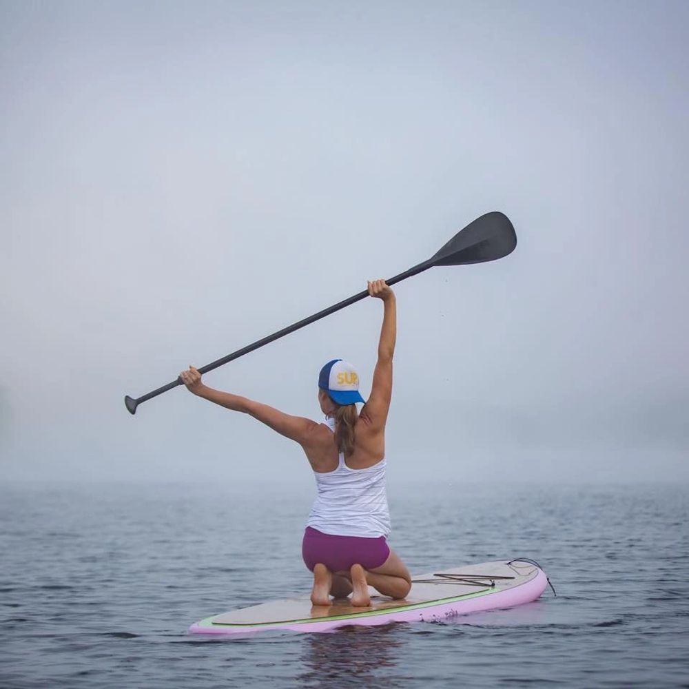Photograph of Stand Up Paddleboard class participant.