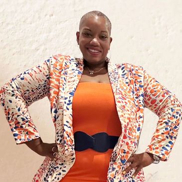 Mariama S. Boney in power pose smiliing