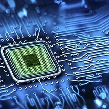 Close-up of a microchip on a blue circuit board.