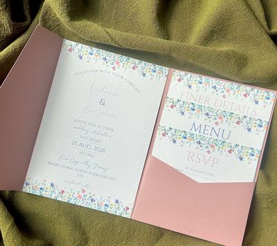 Floral wedding invitation suite with blush pink pocketfold, menu, RSVP, and details cards by Ever Af