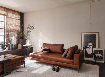 bruin lederen modulaire design zetel met losse rugkussen