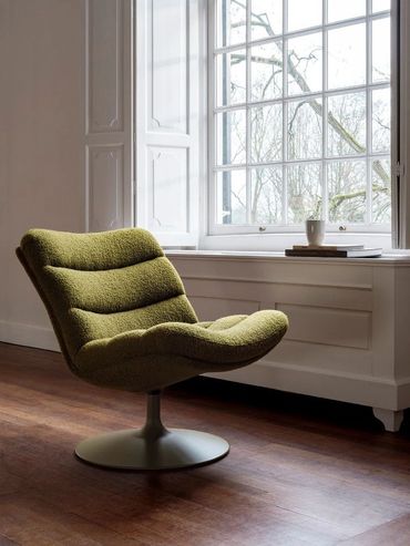 Tijdloos design: de Artifort F506 fauteuil in luxe stoffen bekleding