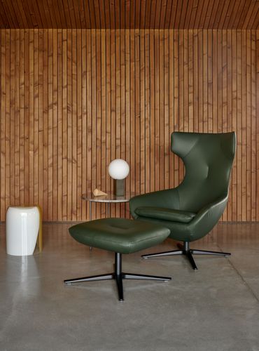 Caruzzo fauteuil van Leolux in groen leder, comfortable design fauteuil met poef