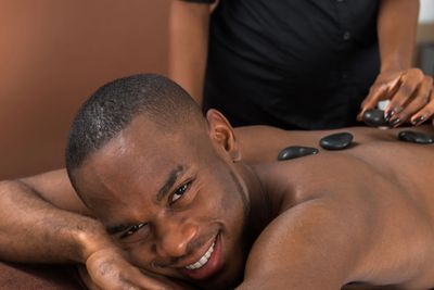Man and Hot Stone massage treatment
