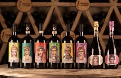 Wine bottles with unique artistic labels featuring female portraits.