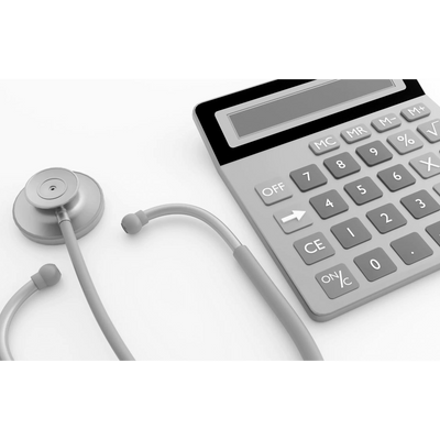 A stethoscope and calculator side by side on a white surface.