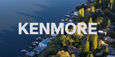 Aerial view of Kenmore lakeside homes with docks along the water.