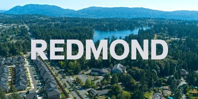 Aerial view of Redmond with residential area and lake.