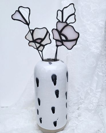 Group of stained glass flowers in a spotted vase