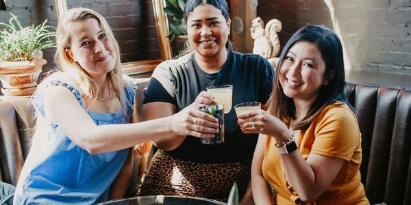 Group of girlfriends toasting at Batson River Brewing.  Photo Credit: Emily Shawstuck