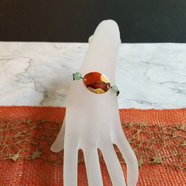 This copper bracelet is colored using alcohol ink.