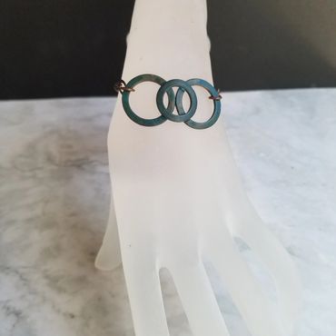 This is a copper patina bracelet.