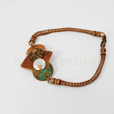 This mixed metal bracelet is cold fused with copper, patina copper and silver pieces.