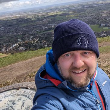Man in hat hill walking