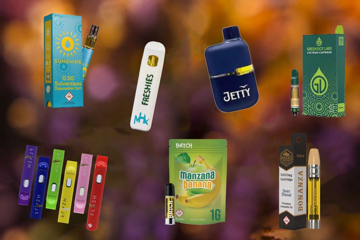 Various cannabis vaping cartridges and disposable pens on a blurred background.