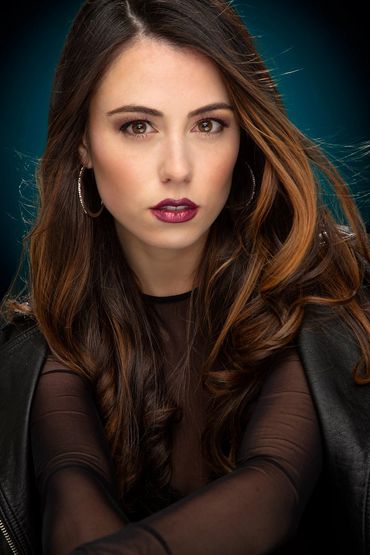 Model shot: Posing For Close-Up Portraiture in Blue studio setting.
Model Marissa.