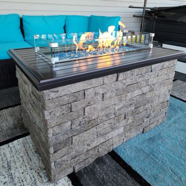 Evolve Stone veneer fire pit surrounding a custom outdoor propane fire feature in Runnemede, NJ