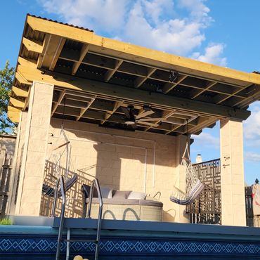 Runnemede NJ poolside pergola finished with Evolve Stone veneer for outdoor living space