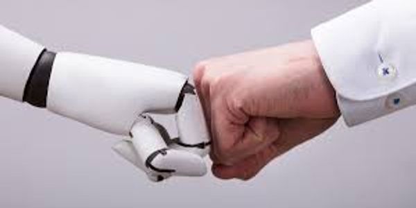 A human and a robot fist bumping in a gesture of cooperation.