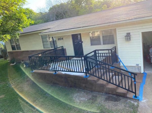 These custom porch and stair rails also have a matching gate at top and away from the stairs. 