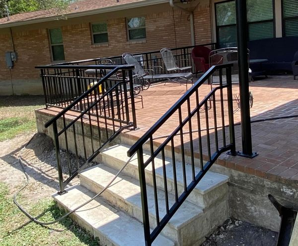 This custom porch railing has an extra wide top for added decor as well as custom stair rails. 