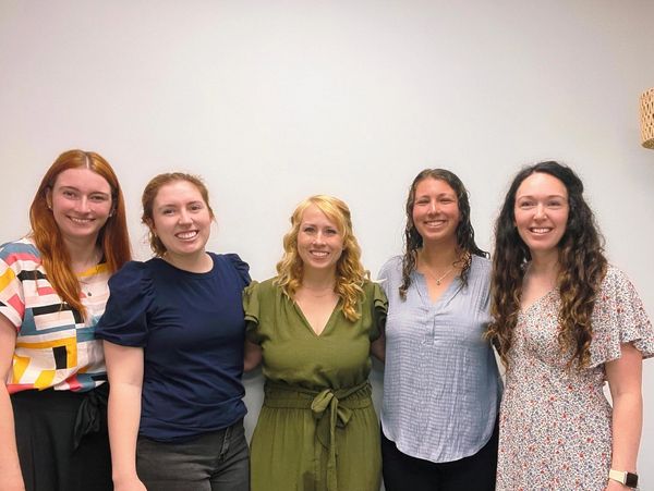 Five female employees and music teachers at Wellness Creative smiling