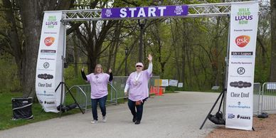 Michelle and her sister Lori coming through the finish line.