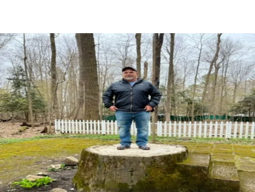 Jeff standing at the famous stump at Lilly Dale, New York.