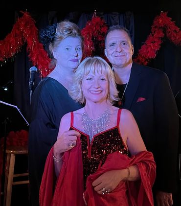 Lisa Faith Phillips, singer Deanna Kirk and John Di Martino on piano.