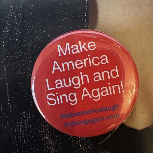 You'll get our Let's Make America Laugh and Sing Again! button.