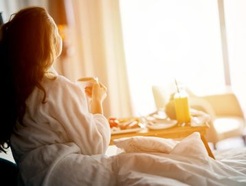 Patient recovering after surgery with twenty fourhour care from her nurse