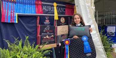 Michelle showing her great accomplishments during her time at the Saratoga Horse Show